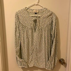 Supe cute, feminine blouse. Crème with little blue flowers. Adorable w/jeans